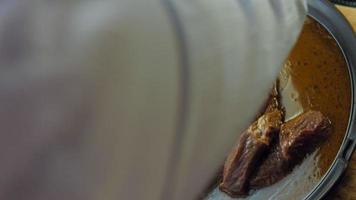 Beef marinated in soy sauce in plastic wrap on a retro tray. Macro shooting. There are air bubbles video