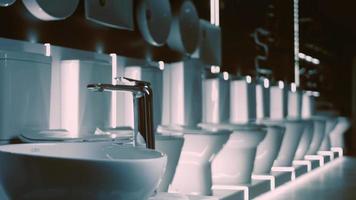 Rotating washbasin. Studio filming. In the background a row of toilets. 4k video