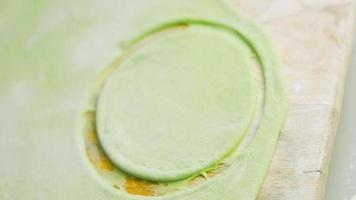 Tortillas prepared and decorated with spinach and beets. Red and green tortillas video