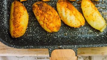 Grilled potatoes which melt in your mouth. The potatoes are in the grill pan