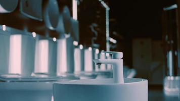 Rotating washbasin. Studio filming. In the background a row of toilets. 4k video