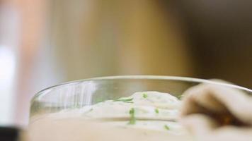 Macro filming of Worcestershire sauce. The chef pours the sauce into a spoon video