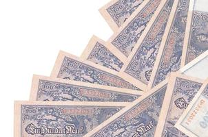 100 Reich marks bills lies in different order isolated on white. Local banking or money making concept photo