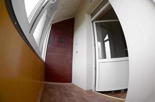 Metal-plastic doors and windows in the loggia or balcony. Fisheye photo