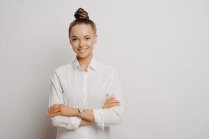 Beautiful female company worker being in good mood photo