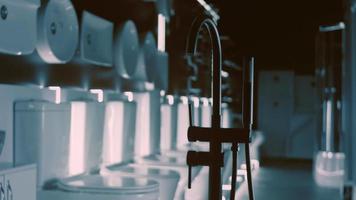 Rotating washbasin. Studio filming. In the background a row of toilets. 4k video