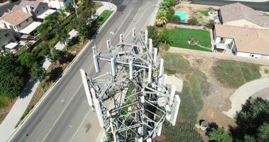 Aerial of Cellular Wireless Mobile Data Tower with Neighborhood Surrounding video