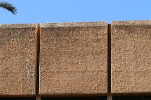 High wall made of stone and concrete. photo