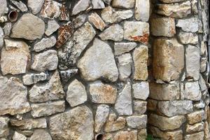 High wall made of stone and concrete. photo