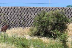 High wall made of stone and concrete. photo