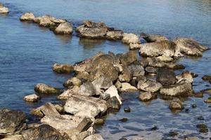 Stones on the shore of the Mediterranean Sea. photo