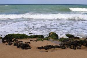 Stones on the shore of the Mediterranean Sea. photo