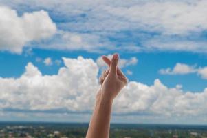 Praying hands on blue sky background,Young man prayed,Religion and spirituality with believe photo