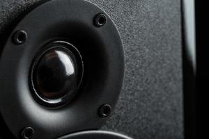 Multimedia speaker system speaker close-up on a black background. photo