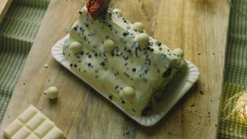 Cake with green dough, sour cherries and sour cream. It also has food ornament and the red star cake video