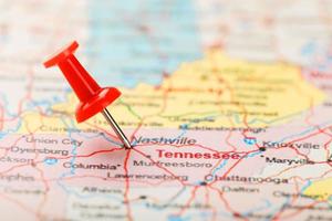 Red clerical needle on a map of USA, South Tennessee and the capital Nashville. Close up map of South Tennessee with red tack photo