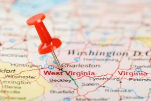 Red clerical needle on a map of USA, South West Virginia and the capital Charleston. Close up map of South West Virginia with red tack photo