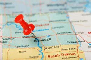 Red clerical needle on a map of USA, North Dakota and the capital Bismarck. Closeup Map North Dakota with Red Tack. United States photo