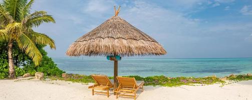 Beach banner panorama. Tropical landscape, two sun loungers, romantic beach view, calm blue sea and palm sea photo