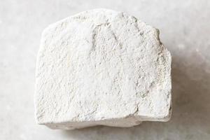 unpolished Chalk stone on white marble