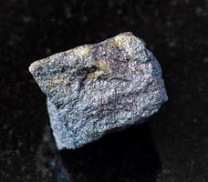 raw Bornite with Chalcopyrite rock on black photo