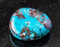polished Chrysocolla with Cuprite rock on black photo