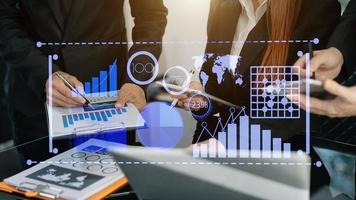 Businessman hand Project manager working and update tasks and Gantt chart scheduling virtual diagram.with smart phone, tablet and laptop photo