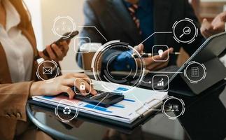 Businesswoman working with smart phone and laptop and digital tablet computer in office with digital marketing media in virtual icon photo