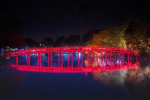 Travel in Vietnam concept, Red bridge in Hoan Kiem lake, Ha Noi, Vietnam, landmark, scenery. photo