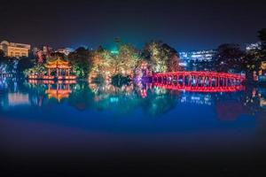 Travel in Vietnam concept, Red bridge in Hoan Kiem lake, Ha Noi, Vietnam, landmark, scenery. photo