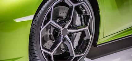 Automotive alloy wheels with tire and disk brake pad cover, Car Maintenance Service concept.