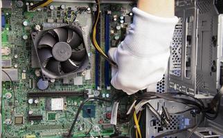 top view mechanic repairing computer photo