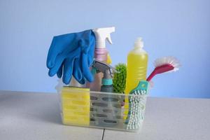 basket with cleaning products for home hygiene use photo