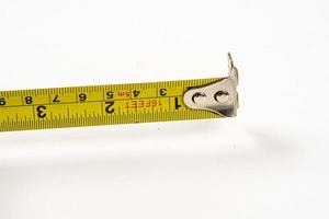 yellow tape measure to measure small spaces photo