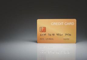 tarjeta de crédito simulada aislada sobre fondo de luz y sombra. concepto de compras. concepto de gasto sin efectivo foto