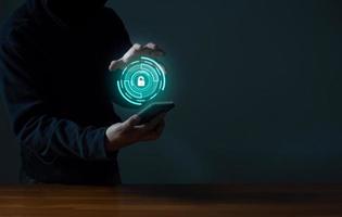 Hackers spy on cell phones. Concept of information security system in internet network and information espionage. photo