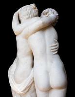 Togetherness emotion. Statue of two people embracing with passion photo