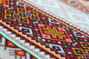 Traditional Ukrainian folk art knitted embroidery pattern on textile fabric photo