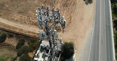 Aerial of Cellular Wireless Mobile Data Tower with Neighborhood Surrounding video