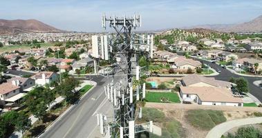 Aerial of Cellular Wireless Mobile Data Tower with Neighborhood Surrounding video