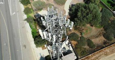 Aerial of Cellular Wireless Mobile Data Tower with Neighborhood Surrounding video