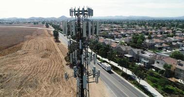 Aerial of Cellular Wireless Mobile Data Tower with Neighborhood Surrounding video