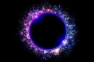 The circular frame is a neon light surrounded by sparkling stars. photo