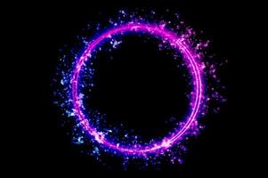 The circular frame is a neon light surrounded by sparkling stars. photo