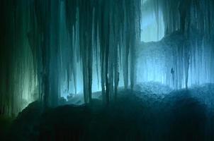 Large blocks of ice frozen waterfall or cavern background photo