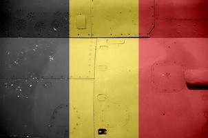 Belgium flag depicted on side part of military armored helicopter closeup. Army forces aircraft conceptual background photo
