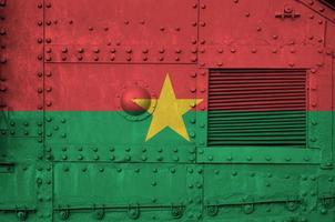 Burkina Faso flag depicted on side part of military armored tank closeup. Army forces conceptual background photo