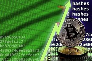 Zambia flag and rising green arrow on bitcoin mining screen and two physical golden bitcoins photo