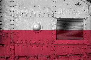 Poland flag depicted on side part of military armored tank closeup. Army forces conceptual background photo