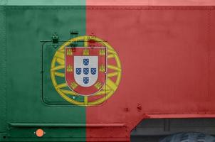 Portugal flag depicted on side part of military armored truck closeup. Army forces conceptual background photo